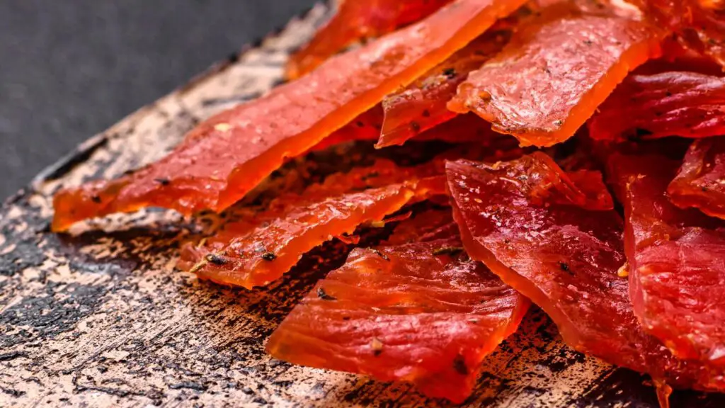 a pile of jerky on a plate - Pemmican Ground Venison Jerky Recipes