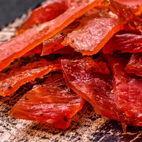 a pile of jerky on a plate - Pemmican Ground Venison Jerky Recipes